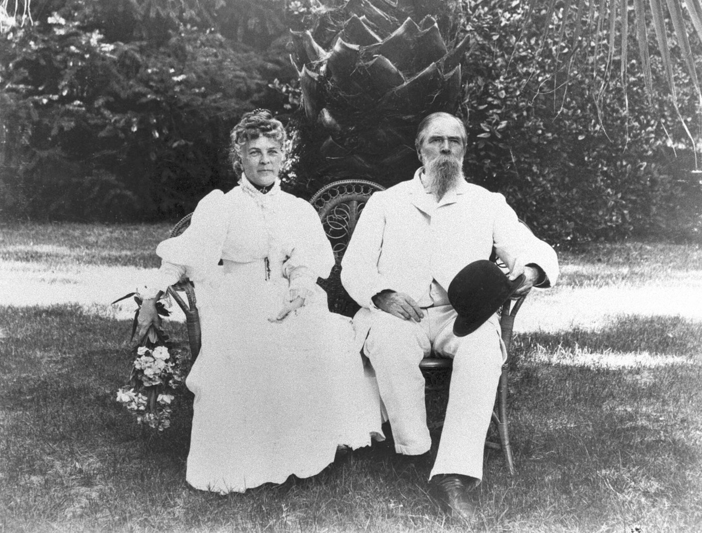 John and Annie Bidwell seated together in a garden, 1895